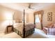 Bedroom showcasing a four poster bed, sitting area, and a matching nightstand at 1002 Vance St, Raleigh, NC 27608