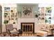 Close-up of the fireplace with decoratively framed painting and flanking built-in shelving at 1002 Vance St, Raleigh, NC 27608