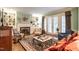 Traditional living room with fireplace, built-in bookshelves, and hardwood floors at 1002 Vance St, Raleigh, NC 27608