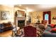 Inviting living room with fireplace, elegant furnishings, and bright natural light at 1002 Vance St, Raleigh, NC 27608
