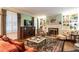 Inviting living room with fireplace, built-ins, hardwood floors, and natural light at 1002 Vance St, Raleigh, NC 27608