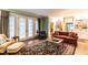 Spacious living room with hardwood floors, built-in shelving, and access to the outdoors at 1002 Vance St, Raleigh, NC 27608