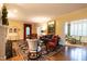 Cozy living room with hardwood floors, classic furniture, and access to bright dining area at 1002 Vance St, Raleigh, NC 27608