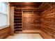 Cedar walk-in closet with natural light, custom shelving and rods at 1002 Vance St, Raleigh, NC 27608