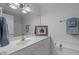 Bathroom features a white vanity, gold fixtures, and decor at 1012 Coram Fields Rd, Wake Forest, NC 27587