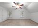 Bright bedroom featuring carpet, a ceiling fan, and windows for natural light at 1012 Coram Fields Rd, Wake Forest, NC 27587
