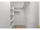 Walk-in closet with built-in shelving and hanging rods for organization at 1012 Coram Fields Rd, Wake Forest, NC 27587