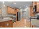 Modern kitchen with wood cabinets, stainless steel appliances, and an open layout at 1012 Coram Fields Rd, Wake Forest, NC 27587