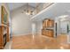 Open-concept living room featuring a fireplace, bar, and view of the upper level at 1012 Coram Fields Rd, Wake Forest, NC 27587