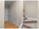 Carpeted staircase, with side door to a closet at 1012 Coram Fields Rd, Wake Forest, NC 27587