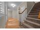 Carpeted staircase leading to the upper level with a view of the hallway at 1012 Coram Fields Rd, Wake Forest, NC 27587