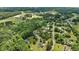 Aerial view showcasing the property's location nestled among lush trees in a serene neighborhood at 102 Ridge Ln, Youngsville, NC 27596