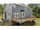 Rear view of the home showcasing the expansive deck, siding, and outdoor living space at 102 Ridge Ln, Youngsville, NC 27596