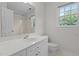 Bright bathroom with white vanity, toilet and shower/tub combination at 102 Ridge Ln, Youngsville, NC 27596