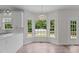 Dining area filled with natural light, thanks to a large bay window offering scenic views at 102 Ridge Ln, Youngsville, NC 27596