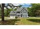 Charming two-story home with a well-manicured lawn, attached garage, and inviting entrance at 102 Ridge Ln, Youngsville, NC 27596