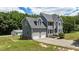 This exterior view reveals a charming two-story home with a large garage and a detached garage at 102 Ridge Ln, Youngsville, NC 27596