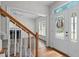 Inviting foyer with decorative door detail, stairs leading up, and a view of the living room at 102 Ridge Ln, Youngsville, NC 27596
