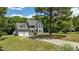 Charming home exterior with a well-manicured lawn and inviting driveway at 102 Ridge Ln, Youngsville, NC 27596