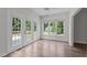 Bright sunroom with backyard access, and windows offering scenic views and natural light at 102 Ridge Ln, Youngsville, NC 27596