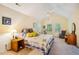 Bright bedroom with carpet and a large bed, ceiling fan, and two windows at 103 Red Cedar Pl, Chapel Hill, NC 27514