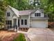 Charming two-story home with a well-manicured lawn, attached garage and a welcoming front porch at 103 Red Cedar Pl, Chapel Hill, NC 27514