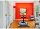 Bright foyer with wood floors, an area rug, and a vibrant red wall at 103 Red Cedar Pl, Chapel Hill, NC 27514