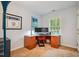 Home office with a desk, computer monitors, natural light, and office furniture at 103 Red Cedar Pl, Chapel Hill, NC 27514