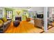 Bright living room with hardwood floors, fireplace, bay window and comfortable seating at 103 Red Cedar Pl, Chapel Hill, NC 27514