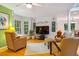 Comfortable living room with plush seating, hardwood floors, a ceiling fan and a large picture window at 103 Red Cedar Pl, Chapel Hill, NC 27514