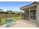 Backyard featuring a charming patio with outdoor seating and manicured lawn at 104 Spindle Dr, Durham, NC 27703