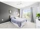 Bedroom with a ceiling fan, carpet and large window at 104 Spindle Dr, Durham, NC 27703