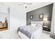 Well-lit bedroom boasting a ceiling fan, bedside lamps, and window at 104 Spindle Dr, Durham, NC 27703