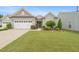 Charming single-Gathering home with a well-manicured lawn, attractive landscaping, and a two-car garage at 104 Spindle Dr, Durham, NC 27703