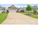 Charming single-Gathering home with a well-manicured lawn, attractive landscaping, and a two-car garage at 104 Spindle Dr, Durham, NC 27703