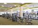 Well-equipped fitness center featuring modern exercise machines, column accents, and overhead lighting in a community amenity center at 104 Spindle Dr, Durham, NC 27703
