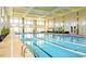 Large indoor swimming pool with lap lanes and bright natural lighting at 104 Spindle Dr, Durham, NC 27703