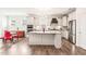 Open-concept kitchen with a large island, stainless steel appliances, and a view of the dining area at 104 Spindle Dr, Durham, NC 27703