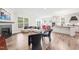 Open-concept living room featuring hardwood floors, a fireplace, and ample natural light at 104 Spindle Dr, Durham, NC 27703
