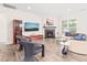 Cozy living room boasts fireplace, hardwood floors, large TV, and comfortable seating arrangement at 104 Spindle Dr, Durham, NC 27703
