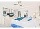 Spacious main bedroom featuring a ceiling fan, tray ceilings, and an ensuite bathroom at 104 Spindle Dr, Durham, NC 27703