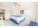 Serene main bedroom with tray ceilings, a ceiling fan, and large windows overlooking the yard at 104 Spindle Dr, Durham, NC 27703