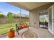 Relaxing screened patio featuring comfortable bench seating and outdoor access at 104 Spindle Dr, Durham, NC 27703