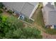 Aerial view of the backyard with a privacy fence, patio, trees, and grass at 1048 Flagler St, Durham, NC 27713
