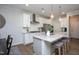 Bright kitchen with a large island, stainless steel appliances, granite counters and open dining area at 1048 Flagler St, Durham, NC 27713