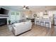 Spacious living room open to the dining area and kitchen, featuring hardwood floors at 1048 Flagler St, Durham, NC 27713