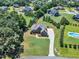 Desirable neighborhood with mature trees, green lawns, and a stately home featuring a long private drive at 105 Somerley Dr, Garner, NC 27529