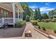 Paved path with lawn games leading to the house with a covered porch at 105 Somerley Dr, Garner, NC 27529