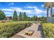 A manicured backyard featuring lawn games and views of the home at 105 Somerley Dr, Garner, NC 27529