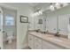 Bathroom with double sinks, granite countertops, and neutral paint at 105 Somerley Dr, Garner, NC 27529